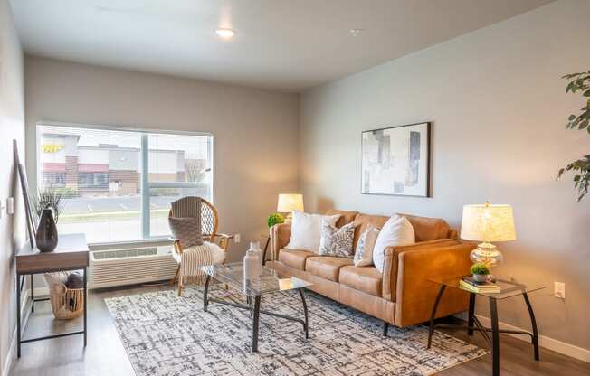 an open living room with a couch and a window at Technology Park Apartments, Minnesota, 55901