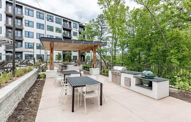 Fun and beautiful outdoor kitchen and seating areas with standard and ceramic grills at Novel Cary