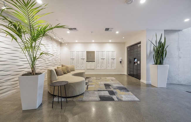 Mail room with seating and decorations Rasa Apartments