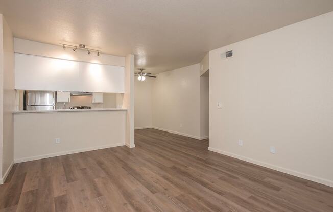A room with wooden flooring and white walls at Sunset Summit, Rocklin, CA, 95765