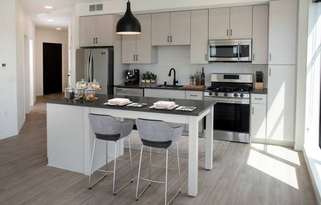 Fitted Kitchen With Island Dining at The Hill Apartments, Saint Paul