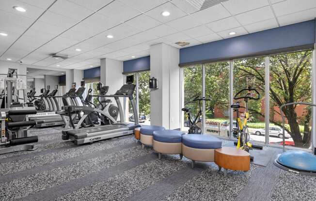 a fitness center with treadmills and other exercise equipment