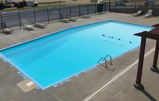 A view of the swimming pool at Cedar Ridge Apartments.