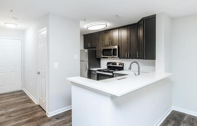 a kitchen with a sink and a mirror