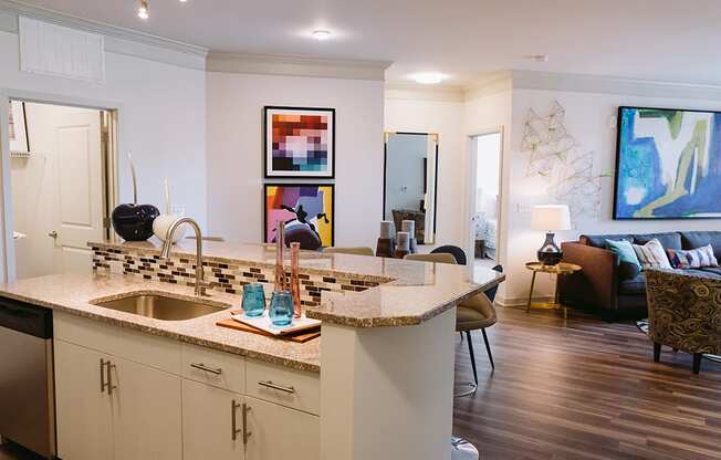 Kitchen with island looking into living room at Sycamore at Tyvola, North Carolina, 28217