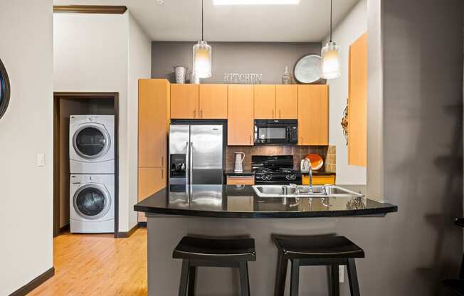 Foothills at Old Town Apartments breakfast bar and stackable washer/dryer