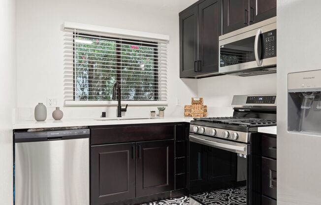 A 4 bedroom, 2 bathroom apartment with common areas and a fully functional kitchen at 1823 Pelham Ave. Unit #4