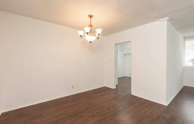 Dining Room with Hardwood Floors and Chandelier