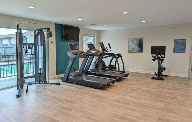 Fitness center with cardio and weight equipment  at Huntsville Landing Apartments, Huntsville, Alabama