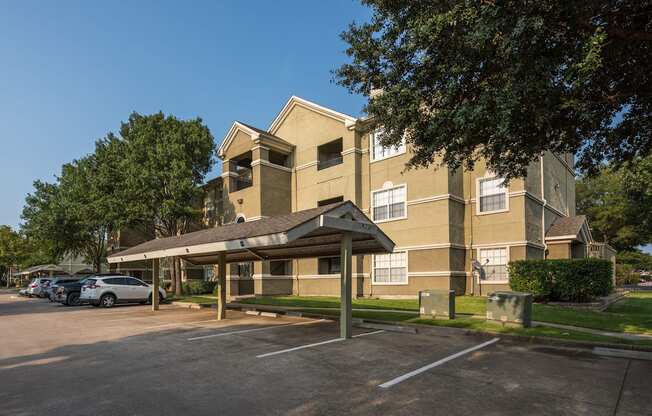 A large building with a parking lot in front of it.