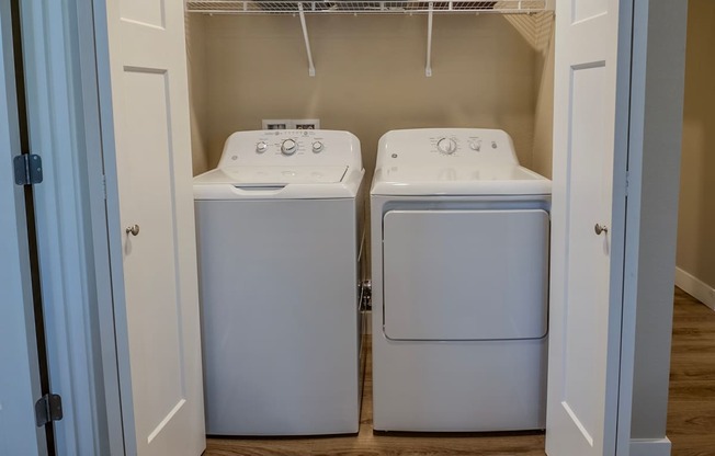 Full size washer and dryer area.