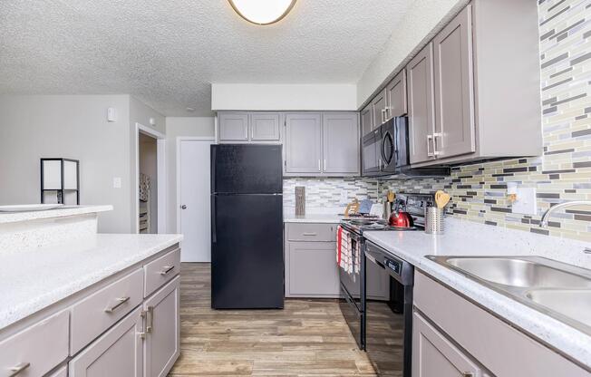 a large kitchen with stainless steel appliances