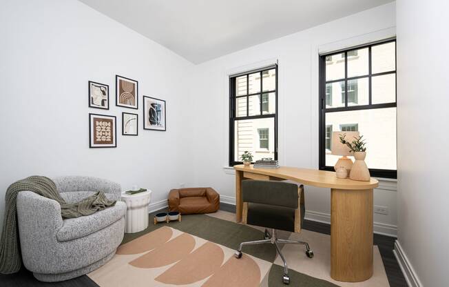 a home office with a chair and a desk and a window  at The Belden Stratford, Illinois, 60614