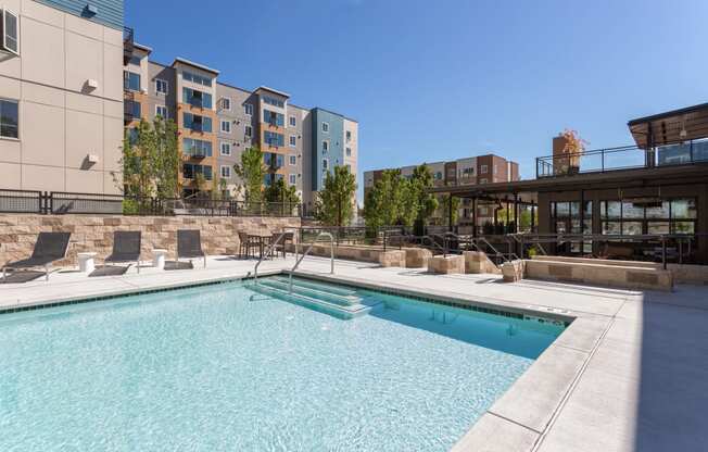 Pool With Sunning Deck at Tivalli Apartments, Washington