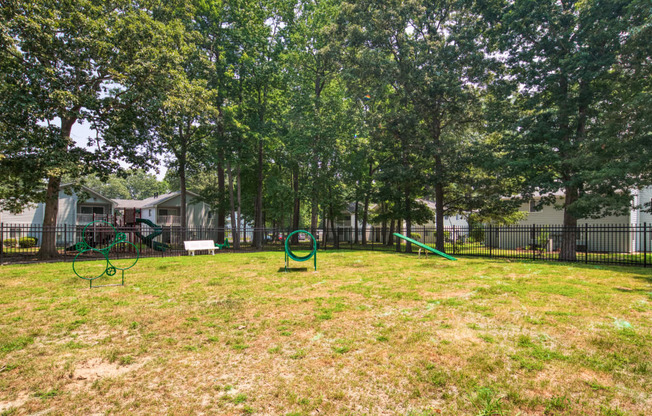 our apartments showcase a dog park with a playground