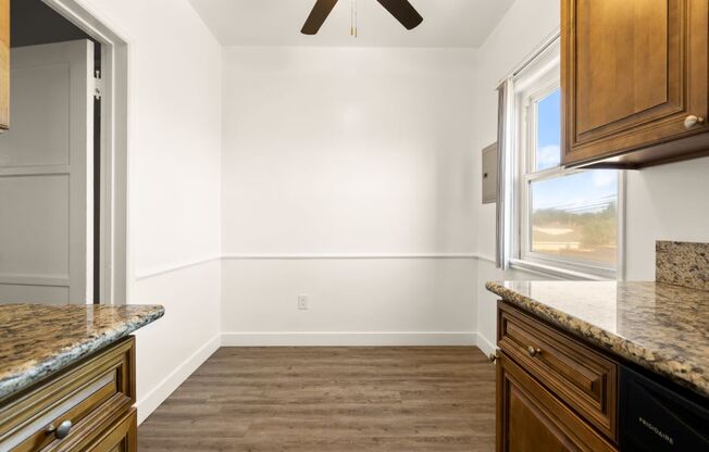 a kitchen with a refrigerator and a window