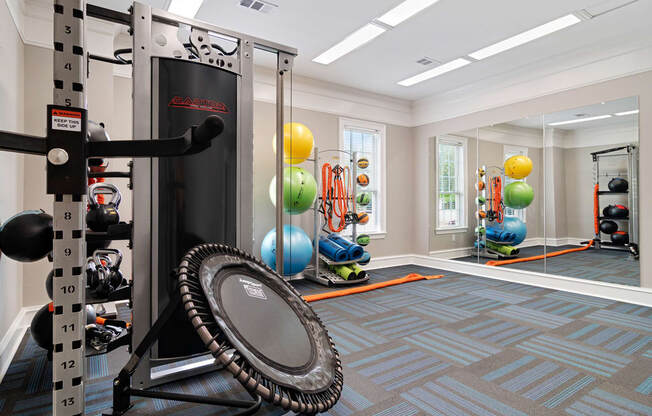 Fitness center with strength and conditioning equipment and large windows for natural lighting