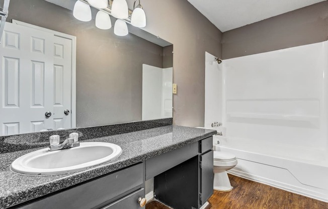 Whitney Manor Apartments in Gretna, LA photo of bathroom with long vanity