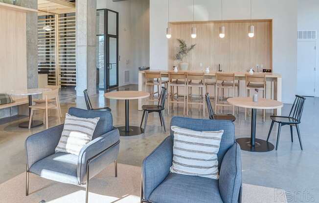 A room with a long table and chairs.