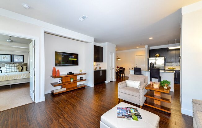 Living Room With Kitchen View at Vanguard Crossing, St. Louis, MO