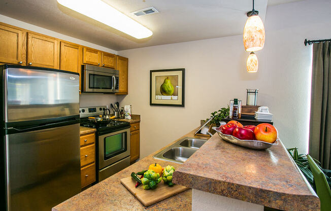 Upgraded kitchen with stainless steel appliances at ABQ apartments near me