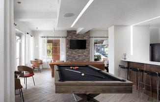 City Place at Westport Resident Clubhouse with Pool Table, TVs, and Various Seating Areas
