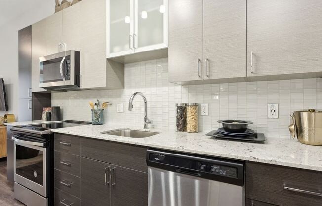 a kitchen with a sink and a microwave