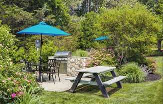 Outdoor Grilling Station with Grill, Table, and Bench