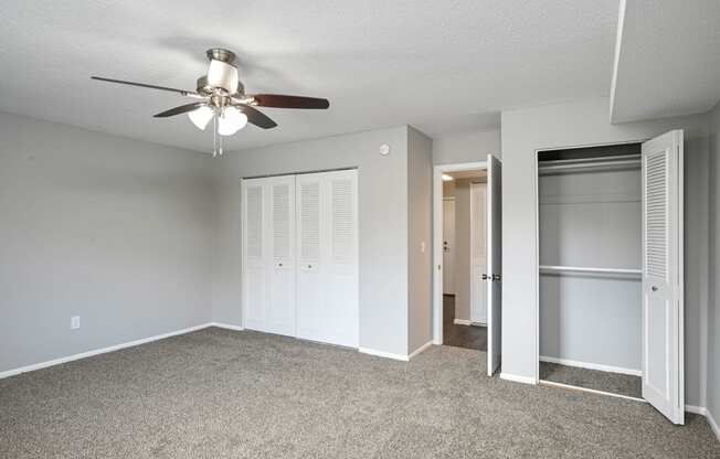 Laurel West End Apartments in Golden Valley, MN photo of bedroom with multiple closets and plush carpeting