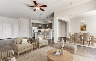 a living room with a dining room and a kitchen