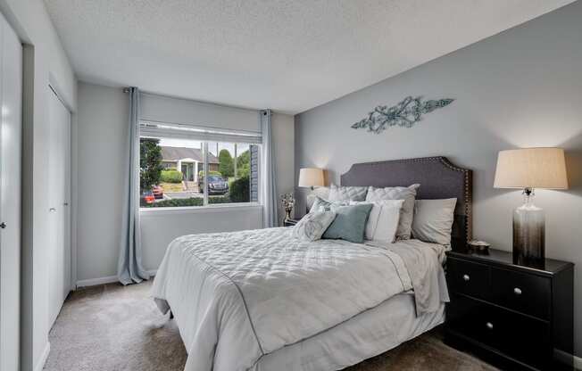 Carpeted Bedroom Featuring Large Windows