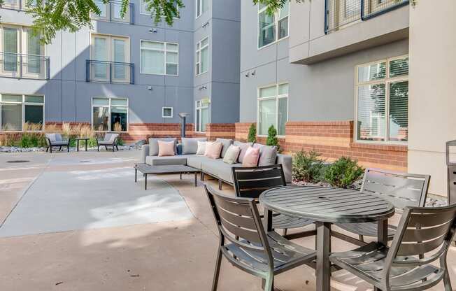 the preserve at ballantyne commons apartment patio with tables and chairs