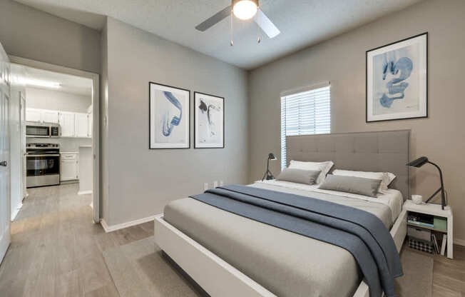 a bedroom with a bed and a ceiling fan at Foxborough Apartments, Irving, TX, Texas, 75061