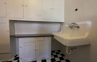 a small bathroom with a sink and a cabinet