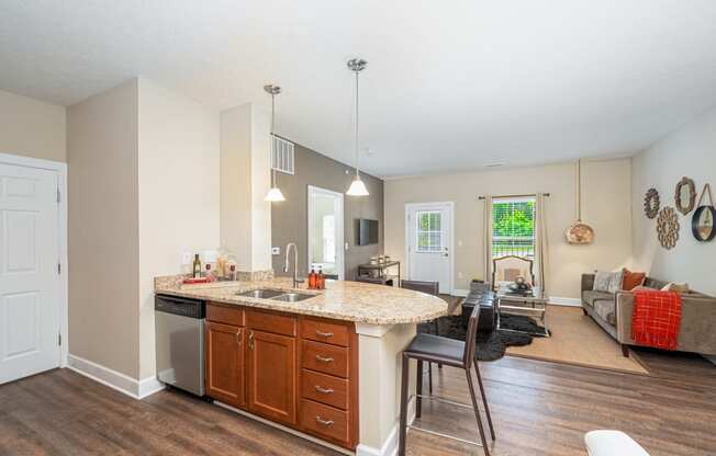 a kitchen with an island and a living room with a couch