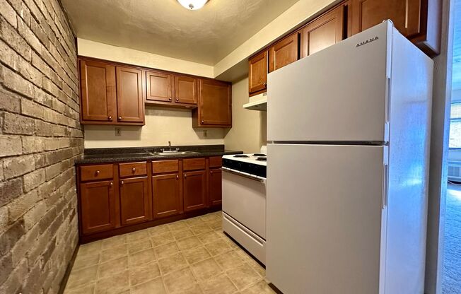Cozy Studio with Beautiful Exposed Brick! Off-Street Parking! Call Now!