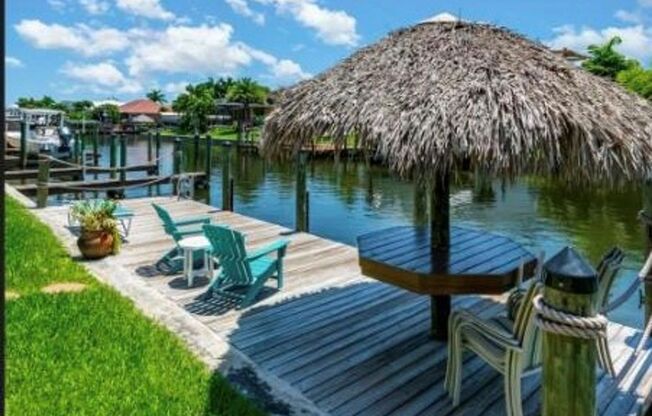 Gulf access canal View with Dock 3 Bedroom 2 Bath Furnished Condo Community Pool and Spa no pets