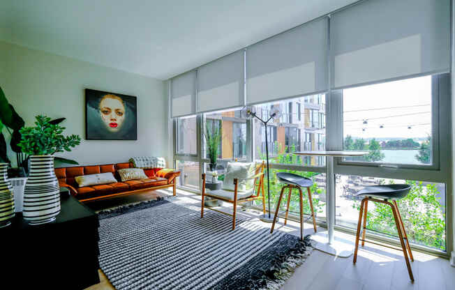 Lounging area with floor to ceiling windows  at Riverpoint apartments Washington, DC 20024