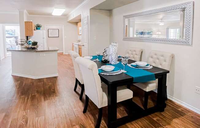 Gates de Provence model apartment kitchen with appliances and a spacious dining room.