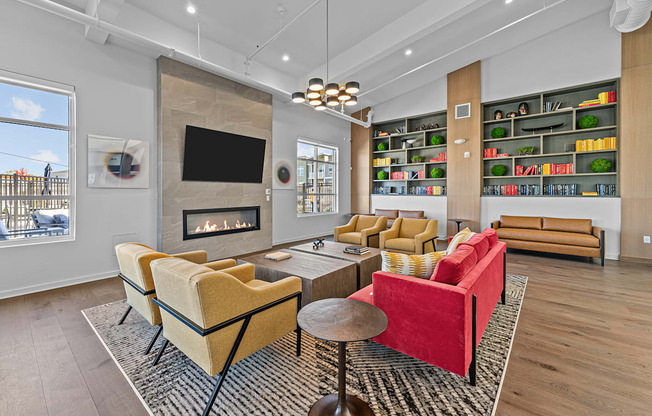 a living room with couches and chairs and a fireplace