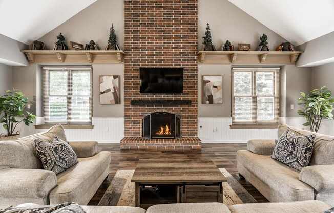 A cozy living room with a fireplace and a couch