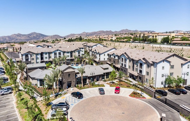 an aerial view of a community with houses and a parking lot