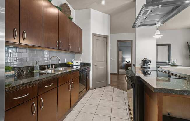 a kitchen with wooden cabinets and granite counter tops