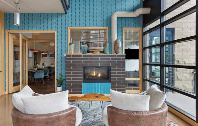 a living room with blue walls and a fireplace
