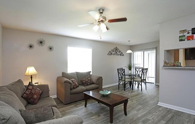 a living room filled with furniture and a table