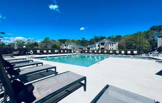 sparkling swimming pool with lounge chairs at Palmetto Place, South Carolina, 29708