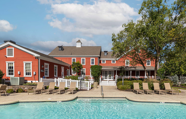 Orchards Apartments Marlborough ma apartment loft style apartments photo of  pool with lounge chairs and red siding clubhouse in background