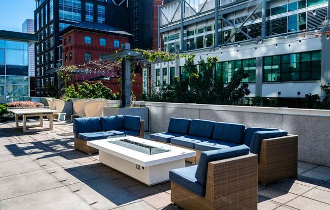 a seating area with couches and a coffee table on a patio