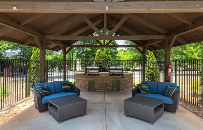 Poolside Grilling Area with Seating located at Twenty35 Timothy Woods in Athens, GA 30606