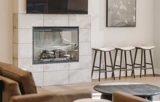a living room with a fireplace and chairs and tables at 44 West Luxury Living, Valley Park, 63088